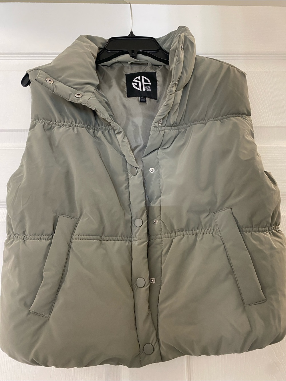 Puffy Sleeveless Vest in Sage Green by Staccato